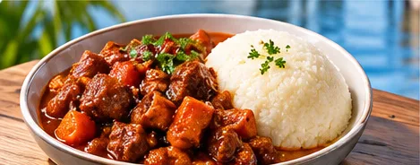 A bowl of beef stew served with sadza