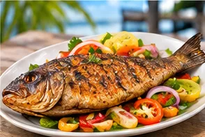 A medium bream on a plate with salad