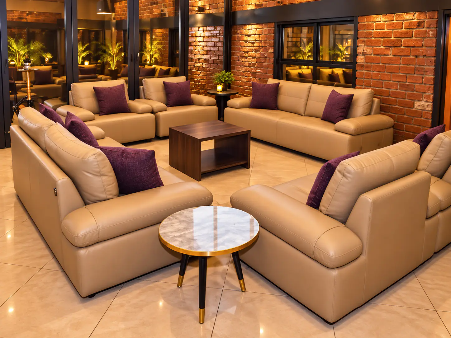 Leather sofas with plum cushions in the lounge